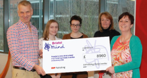 Photo | Tom Hore, Director of Bristol Mind (left) receives the cheque from IOP Publishing staff.