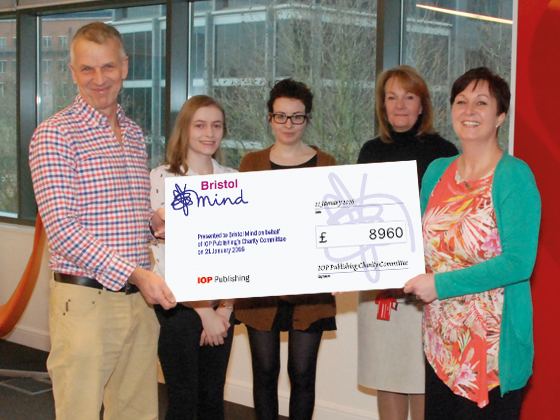 Photo | Tom Hore, Director of Bristol Mind (left) receives the cheque from IOP Publishing staff.