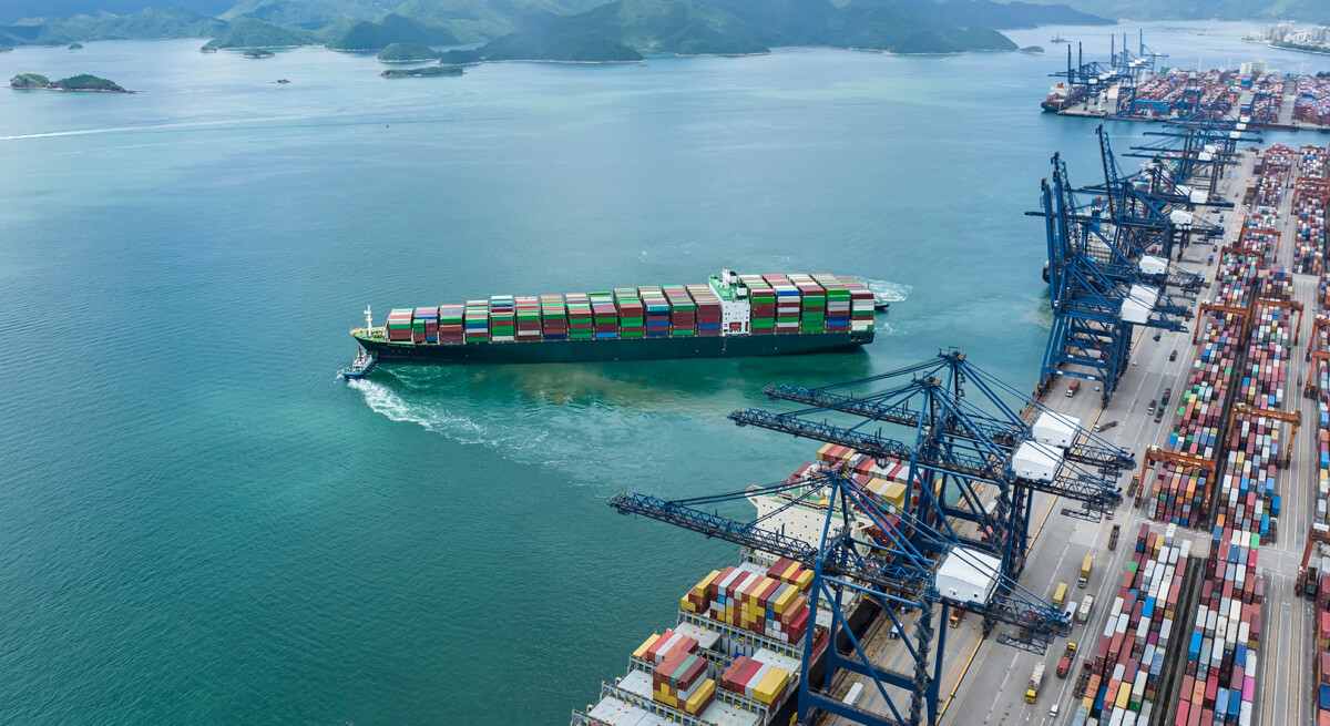 Ariel view of cargo container ships at port.